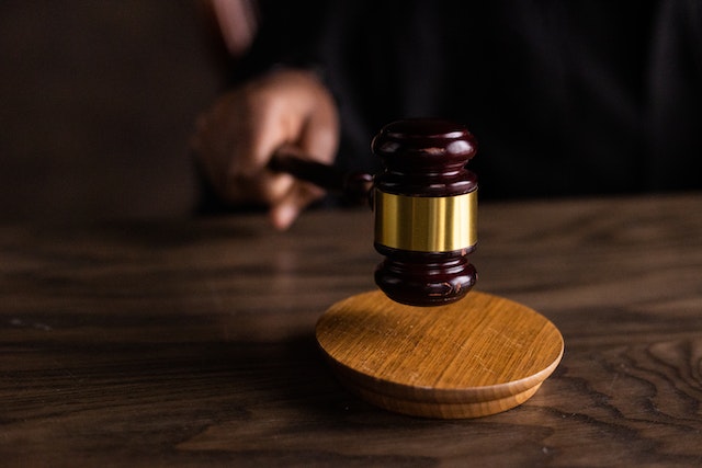 a judge bangs a wooden gavel